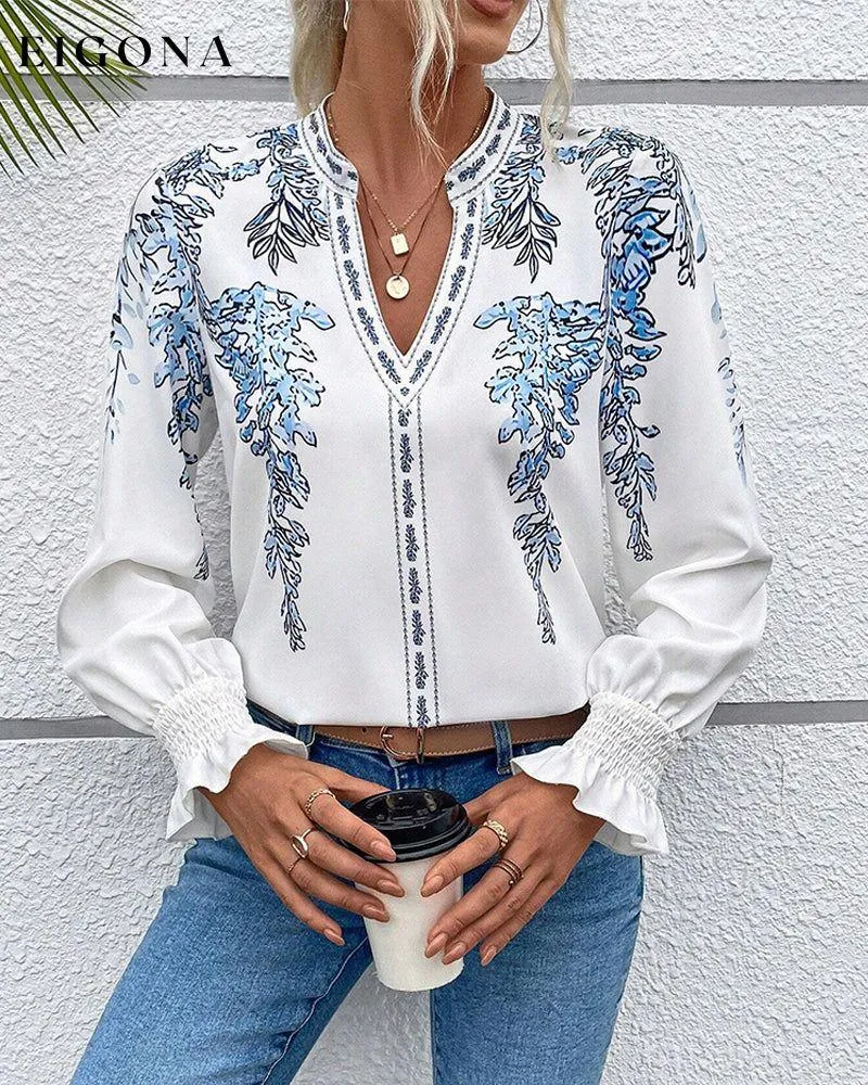 Elegant long-sleeve blouse with leaf print