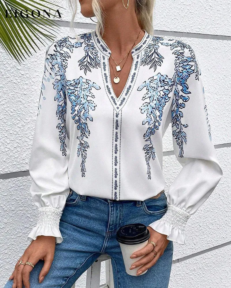 Elegant long-sleeve blouse with leaf print