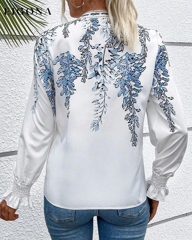 Elegant long-sleeve blouse with leaf print