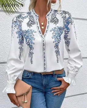 Elegant long-sleeve blouse with leaf print