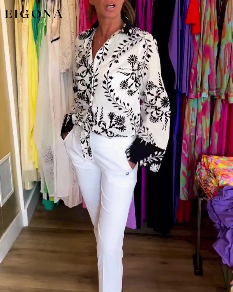 Elegant top with printed lapels and lantern sleeves