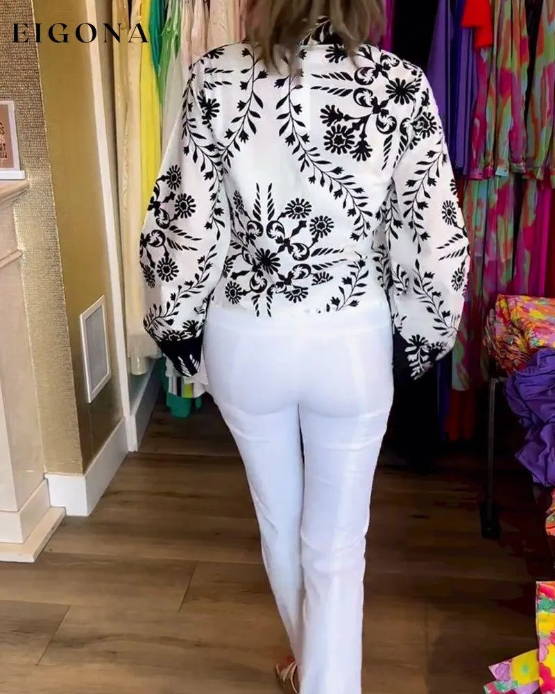Elegant top with printed lapels and lantern sleeves